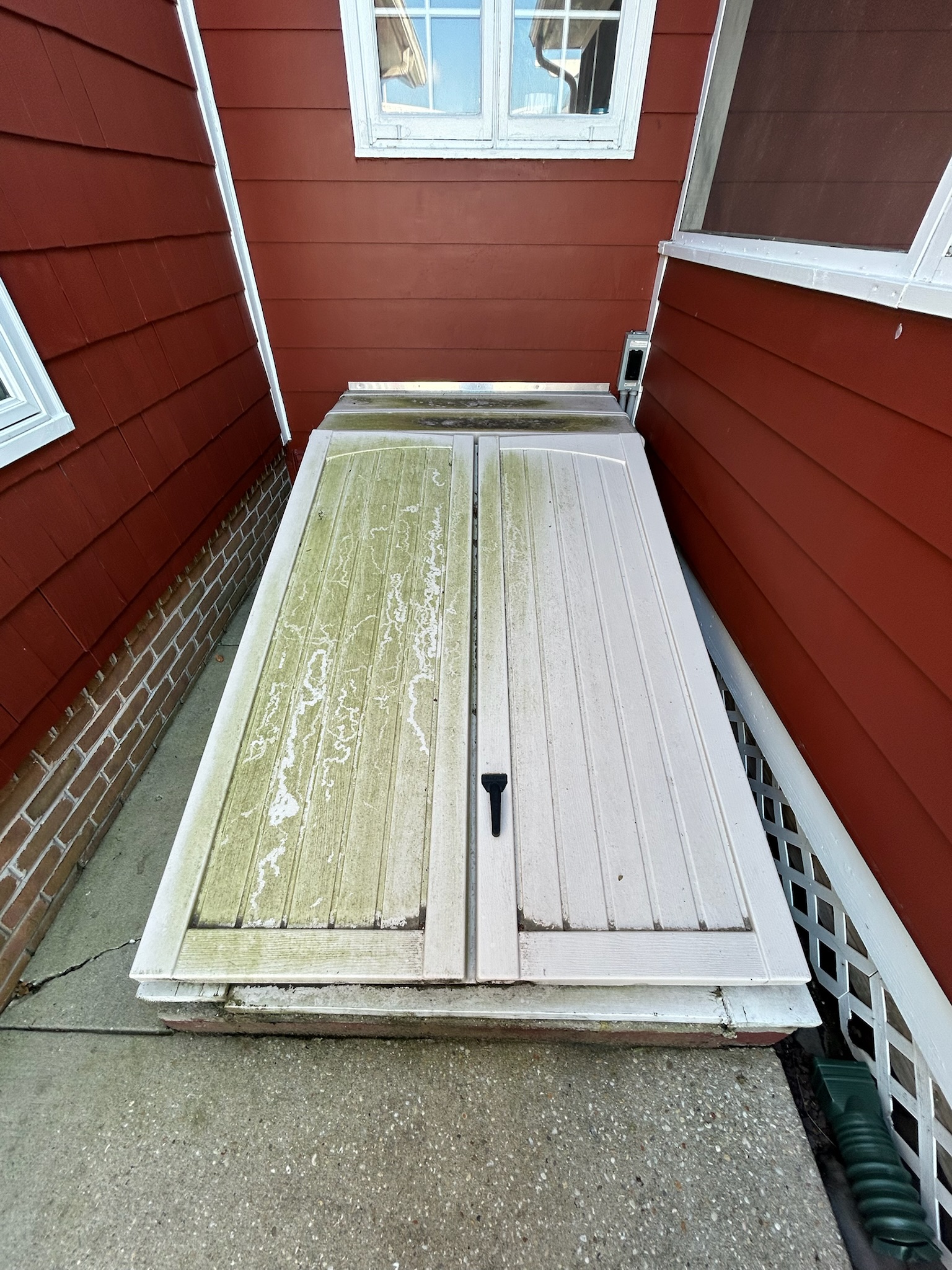 Patio storage cover before cleaning