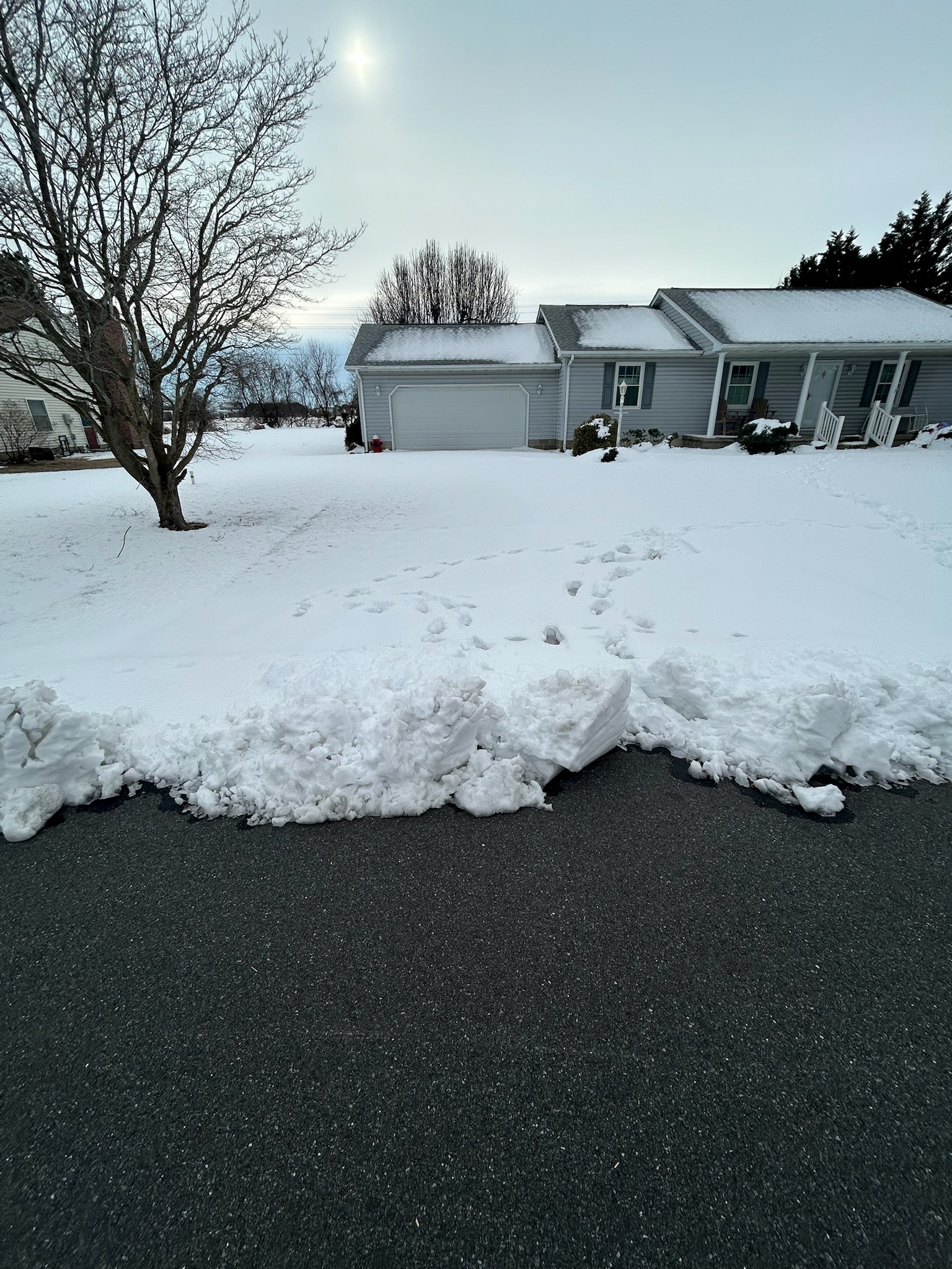 Snow-covered driveway before service