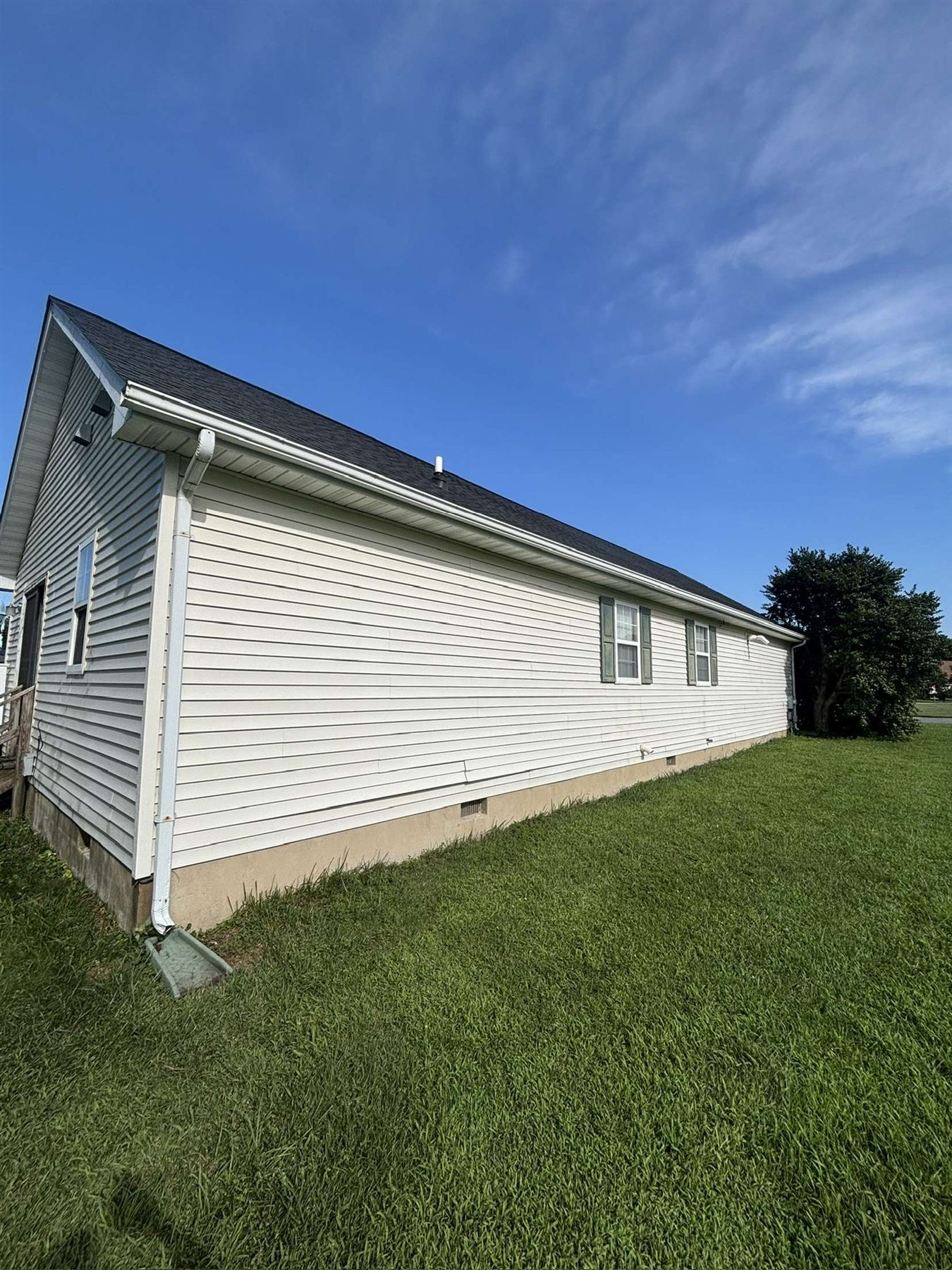 After house washing in Milford Delaware showing clean siding