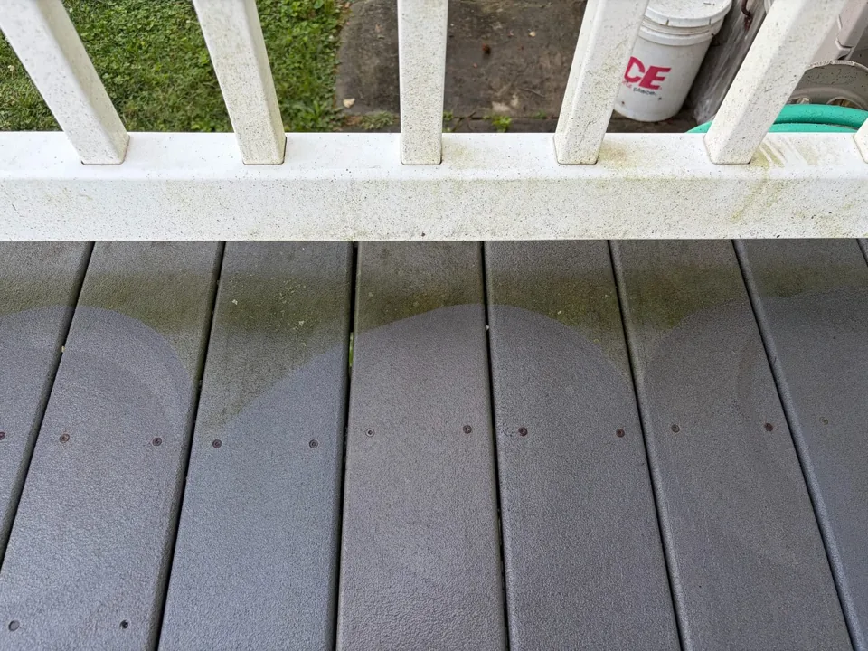 Composite deck boards before power washing