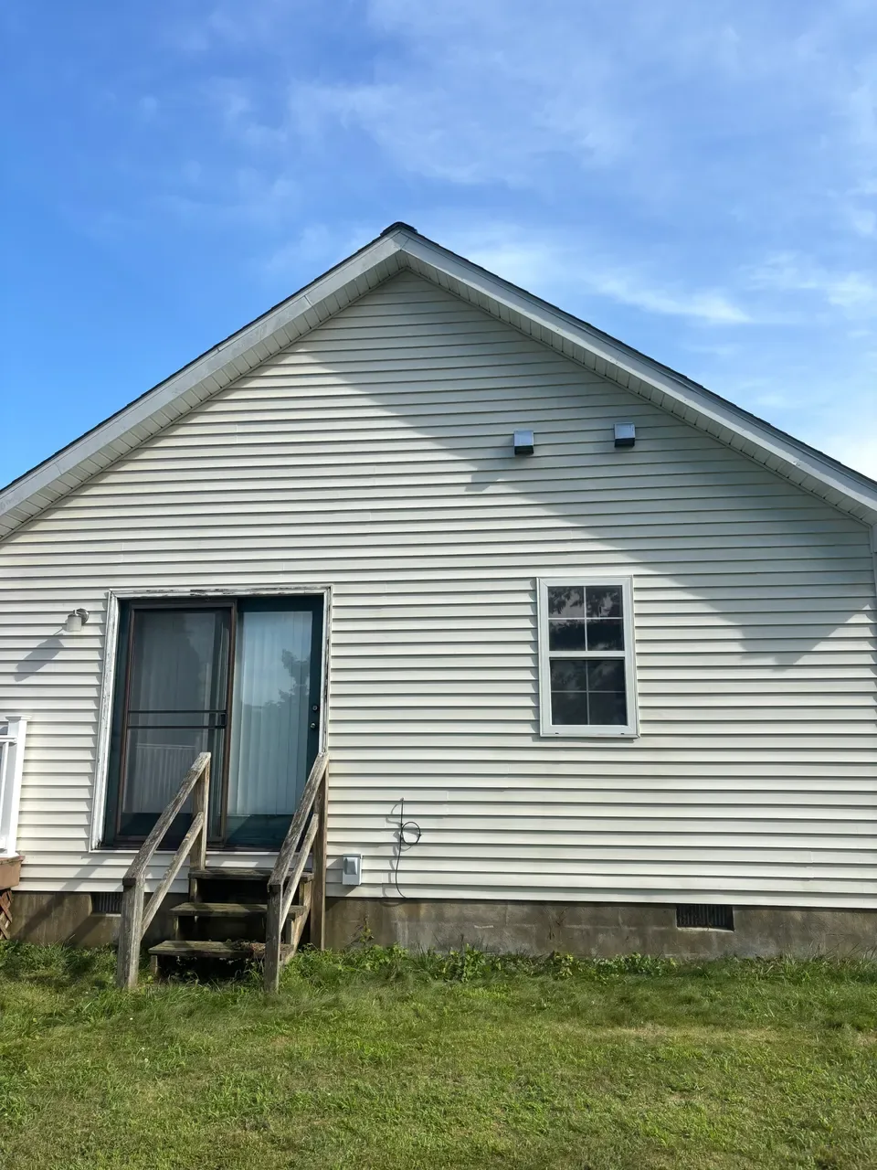 Clean vinyl siding on the rear gable after washing